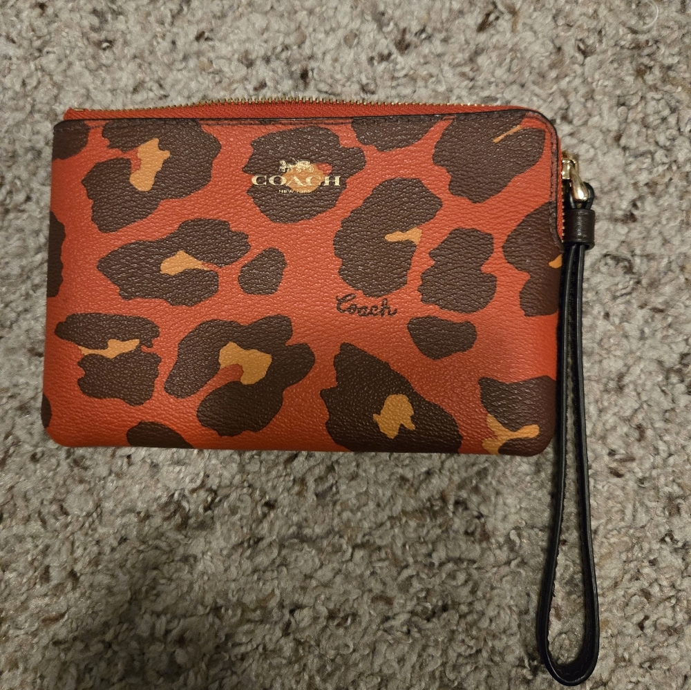 Coach corner zip wristlet red animal print